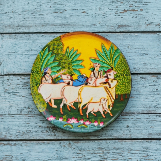 Decorative plate with a colorful design of people and animals on a wooden surface