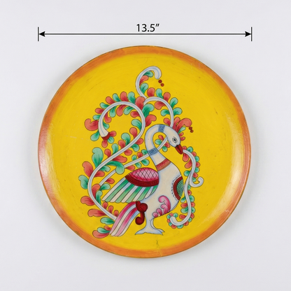 Decorative plate with a colorful peacock design on a yellow background, with dimensions indicated.