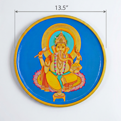 Decorative plate with a colorful Lord Ganesh depiction of a deity on a blue background.