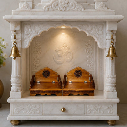 White marble pooja unit with wooden altars and gold accents on a neutral background