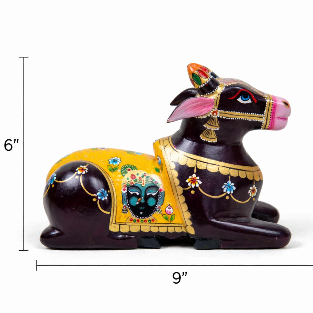 Decorative cow figurine with colorful patterns and measurements on a white background