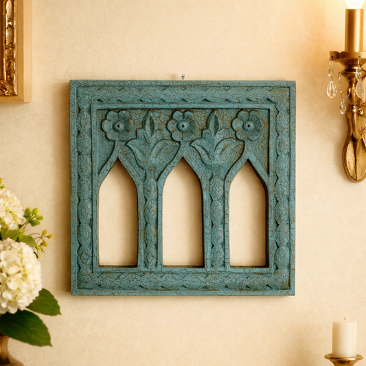 Decorative blue wall art piece frame jarokha on a beige wall