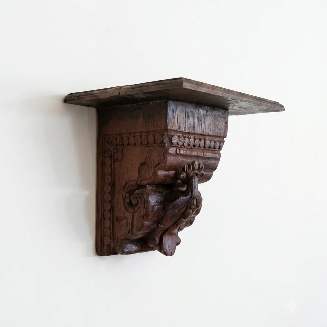 Wooden wall bracket with intricate carvings on a white background