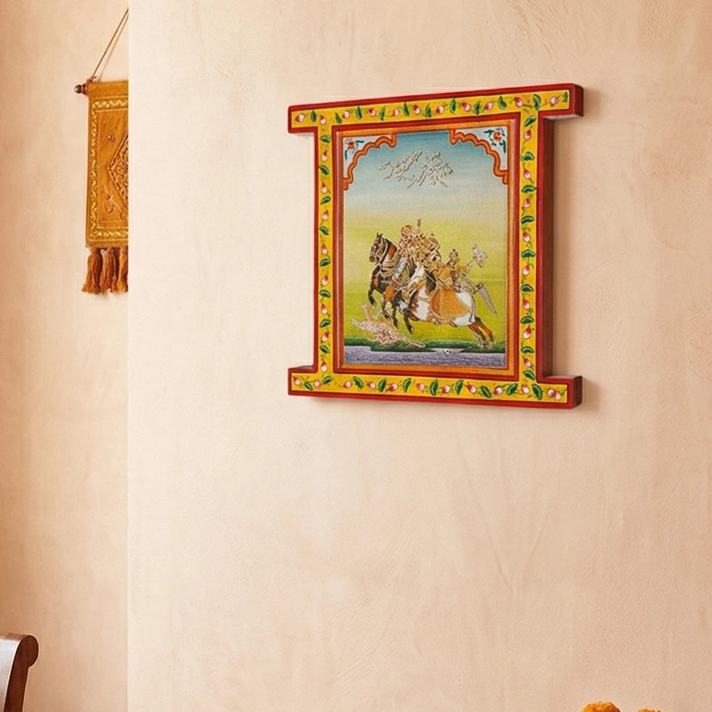 Decorative wall art with a colorful frame on a beige wall.